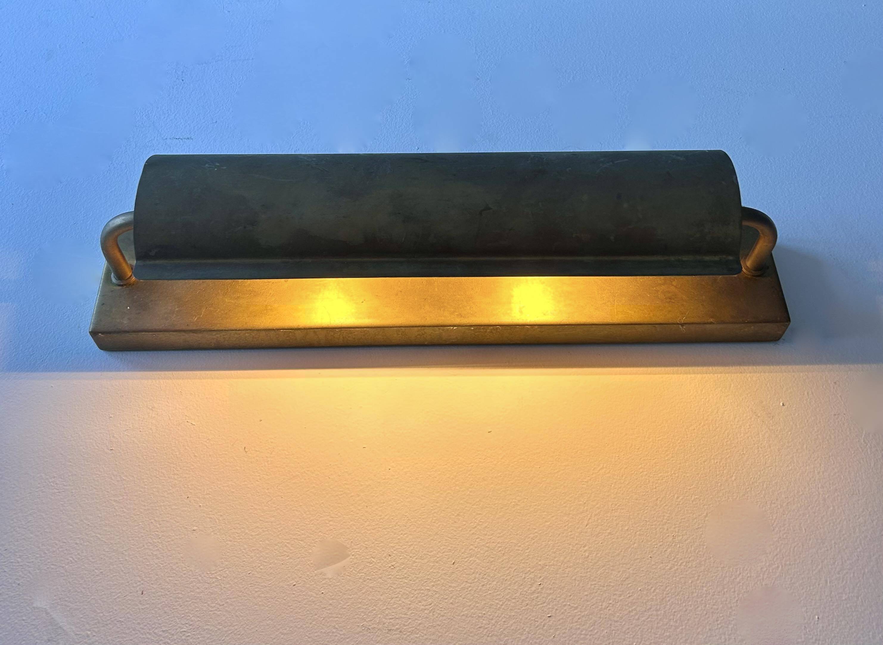 Modernist solid brass wall light, France 1940