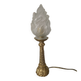 Table lamp with brass base and vintage flame globe