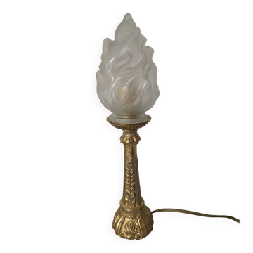 Table lamp with brass base and vintage flame globe