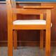Armchair by André Sornay, stained solid beech & beige faux leather. 1980