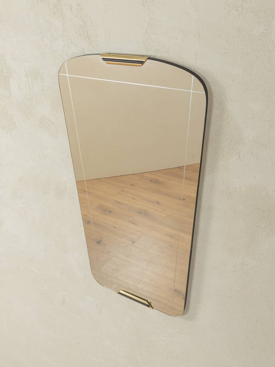 Classic 1950s mirror in black lacquered wooden frame with two brass elements