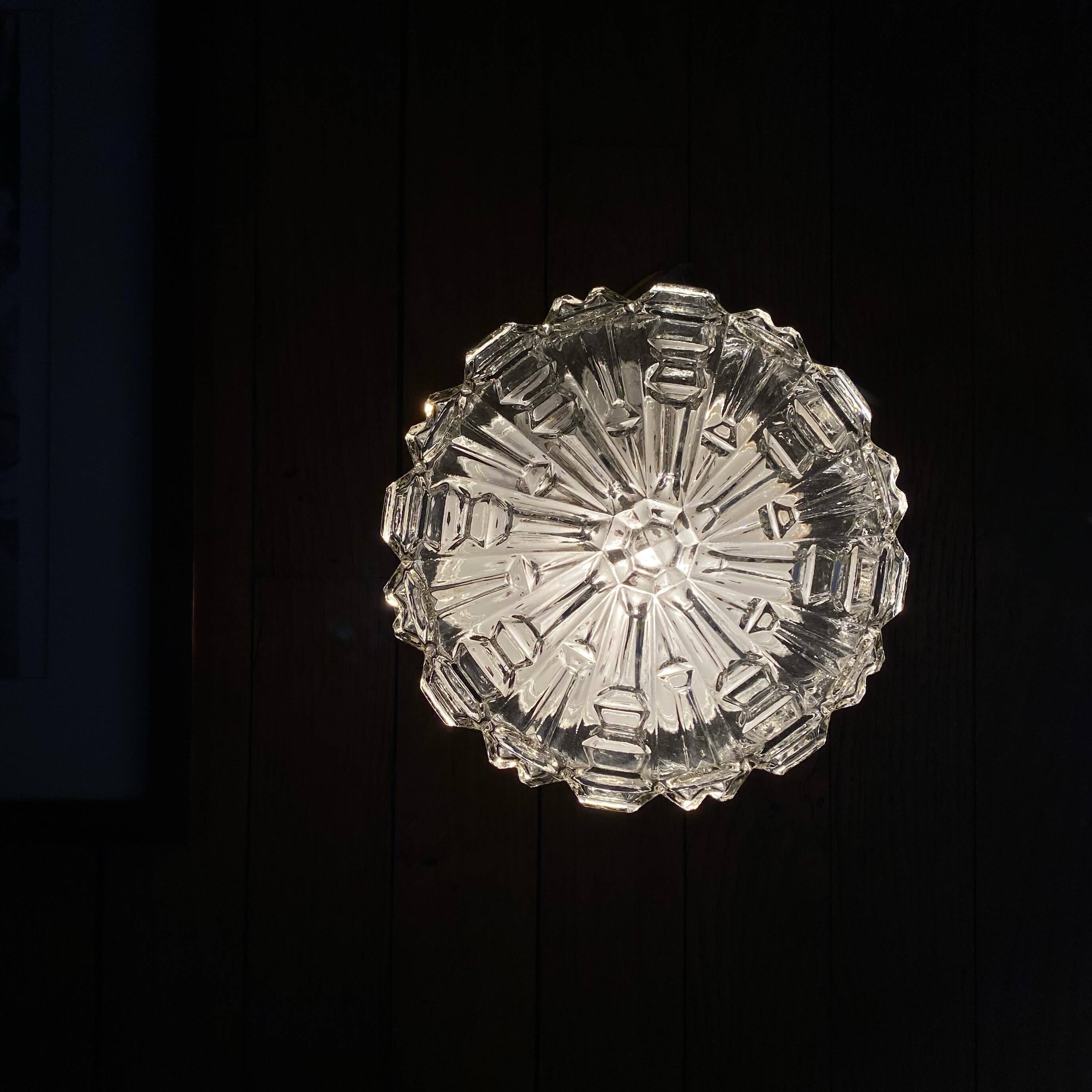 Wall lamp or ceiling light with minimalist porthole glass.