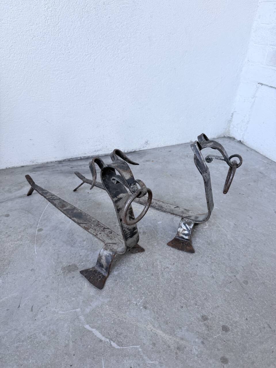 Pair of zoomorphic metal andirons "dogs" 1950