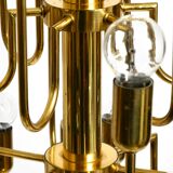 Three staged 18 arm Mid Century brass chandelier with a long brass rod