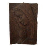 Carved wooden plaque representing a Madonna with folded hands