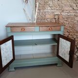Buffet made of natural wood and bronze green.