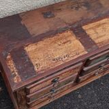 Furniture low in colorful wood. 12 drawers and 1 door