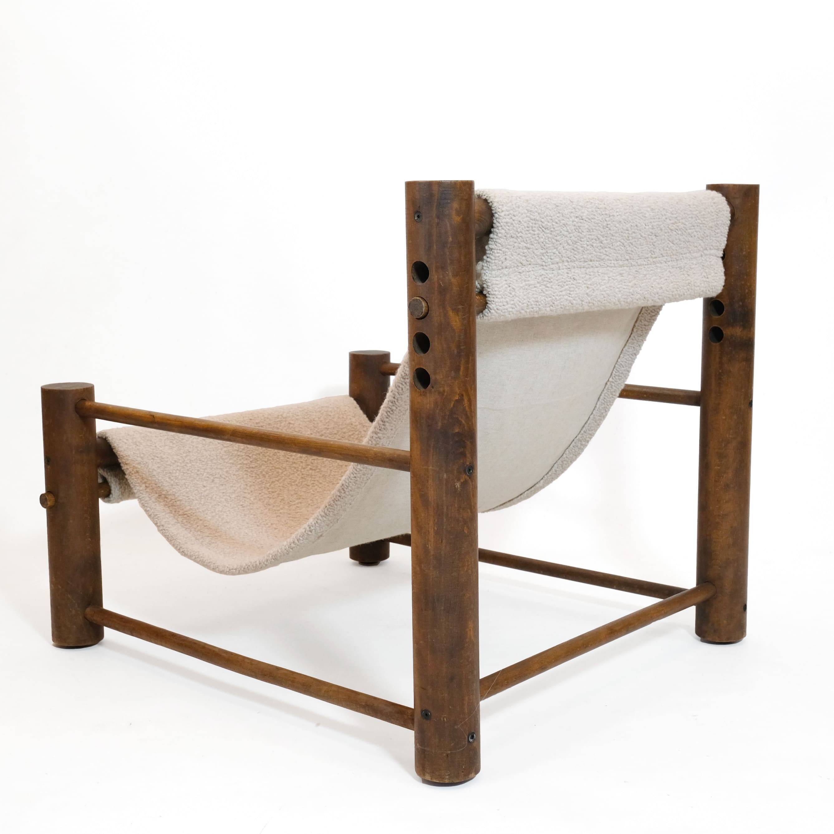 Solid wood armchair with adjustable backrest.