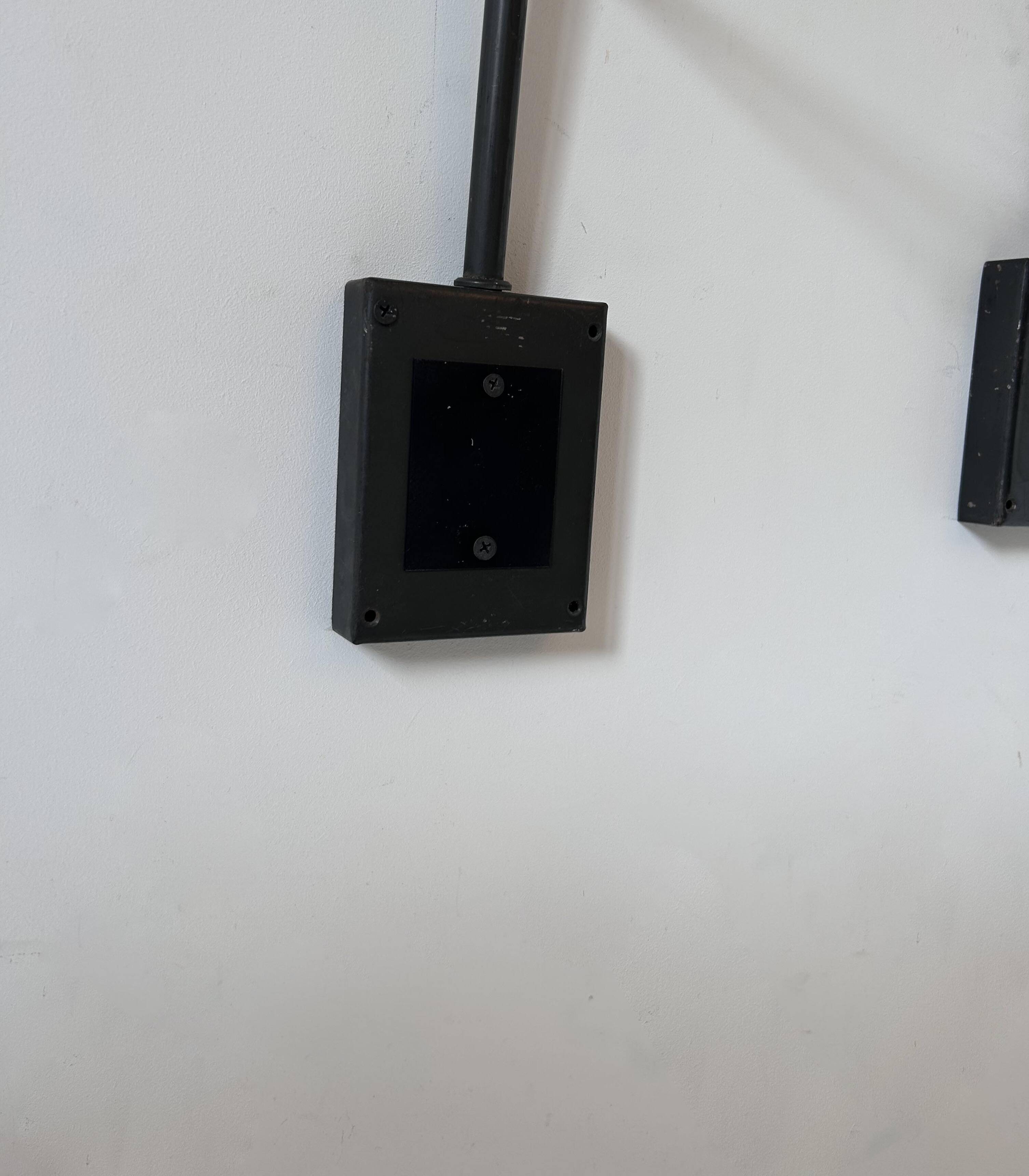 Pair of vintage adjustable wall lights, matte black metal, France 1960s