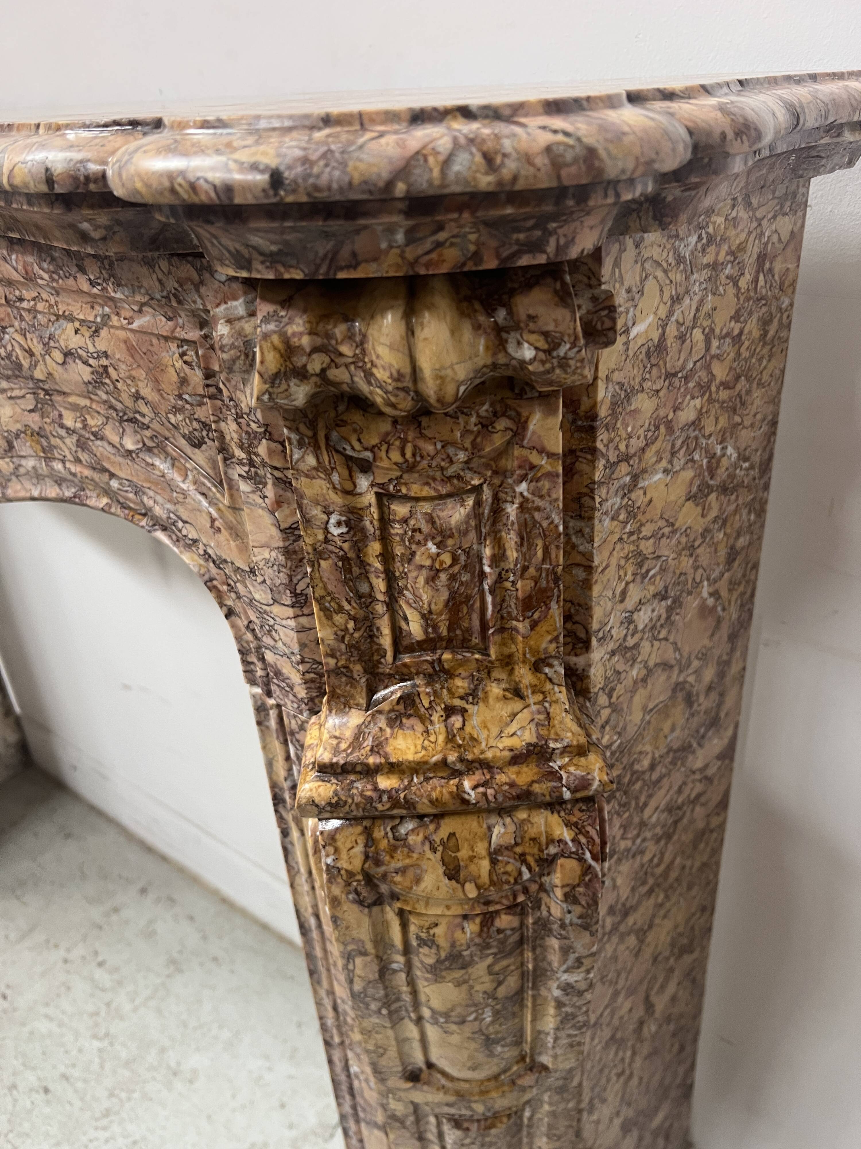 Louis XV style fireplace, Pompadour model, speckled breccia marble, 19th century