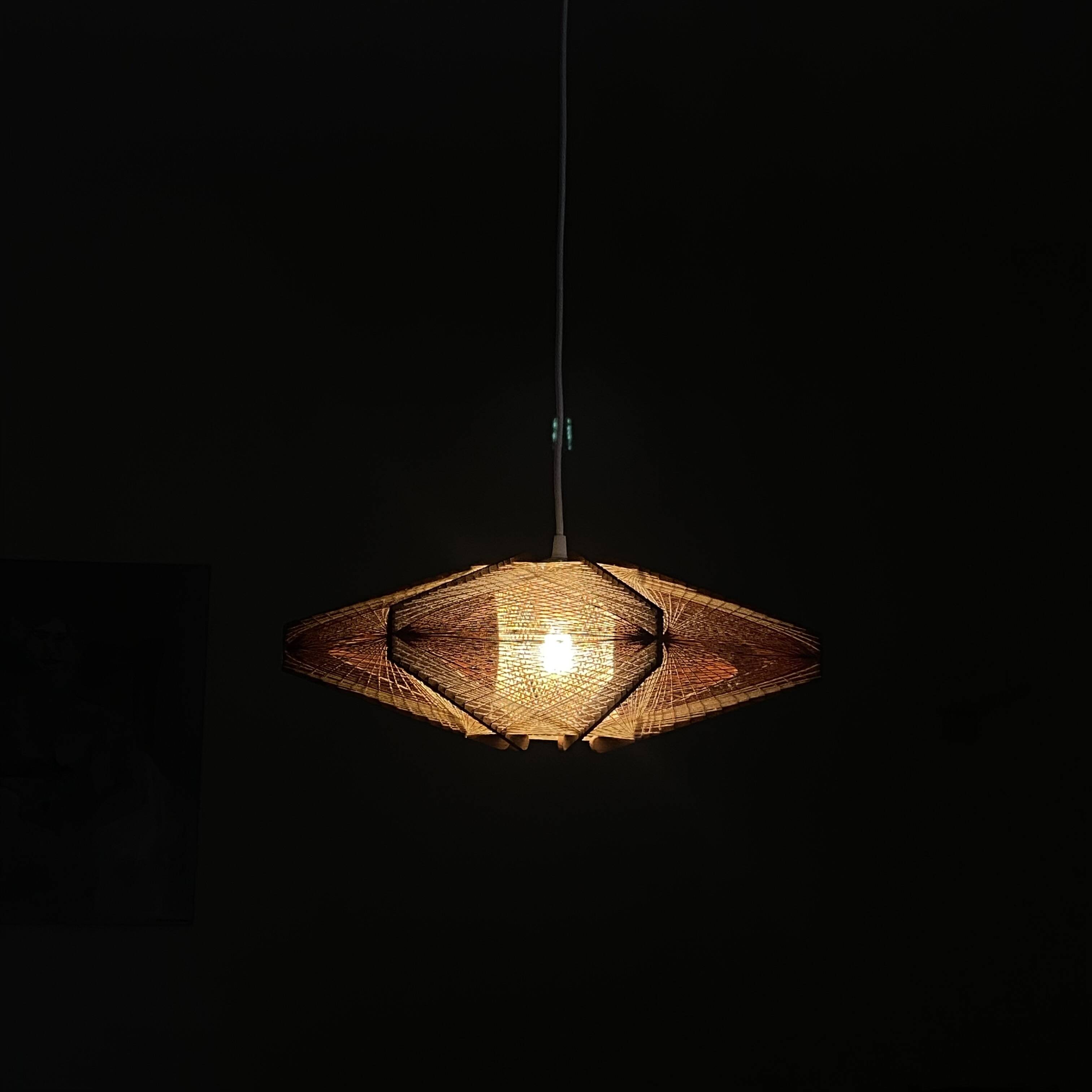 Vintage Scandinavian pendant light with stretched wires.