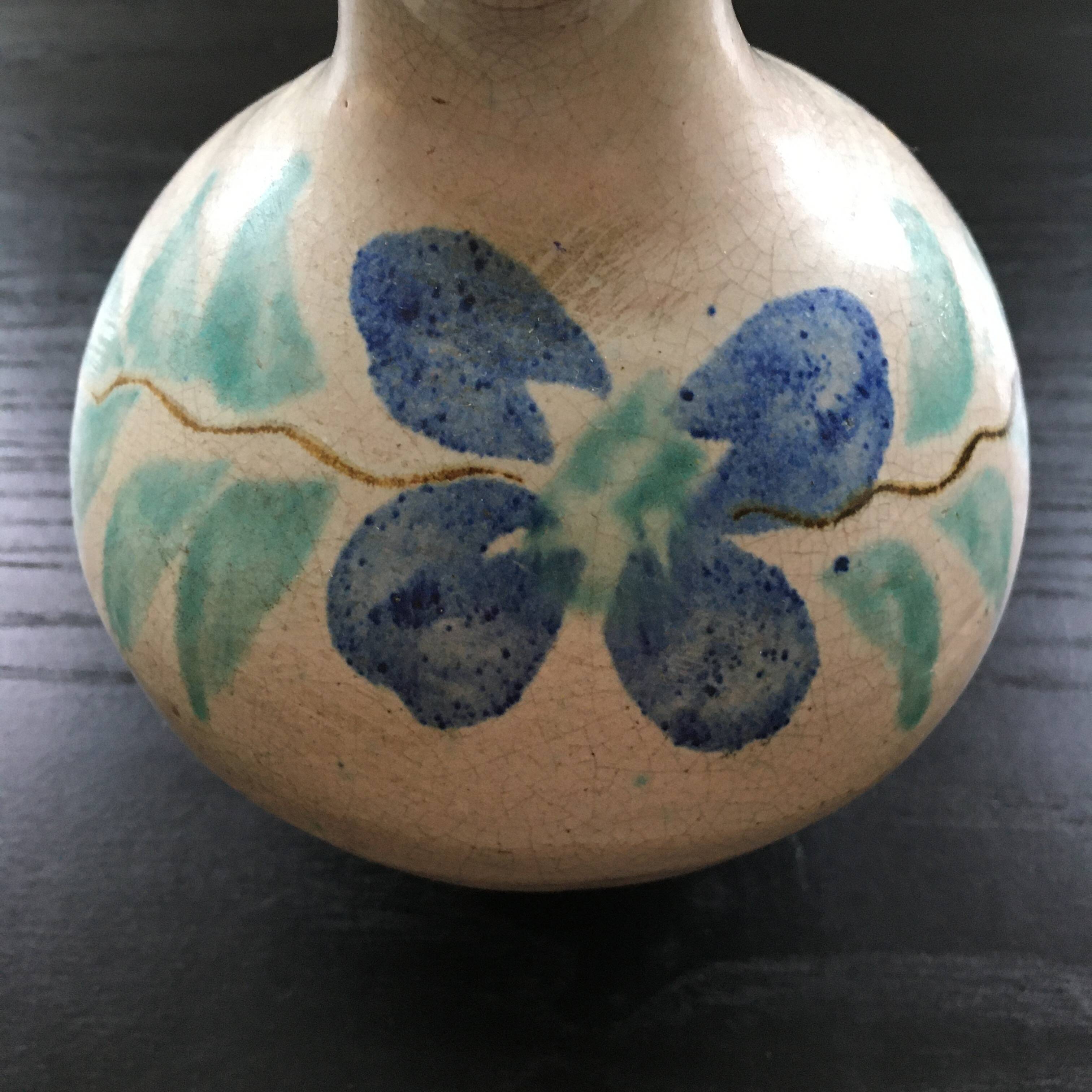 Antique pitcher with floral decoration