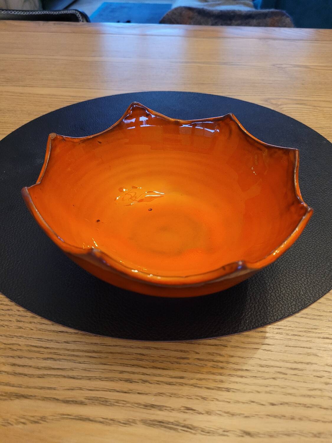 Orange ceramic star-shaped empty bowl