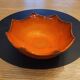 Orange ceramic star-shaped empty bowl