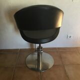 Professional vintage chair sitting in leather and chrome feet adjustable