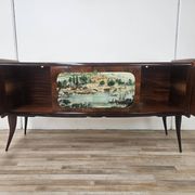 1950s mahogany sideboard with a glass top and central bar.