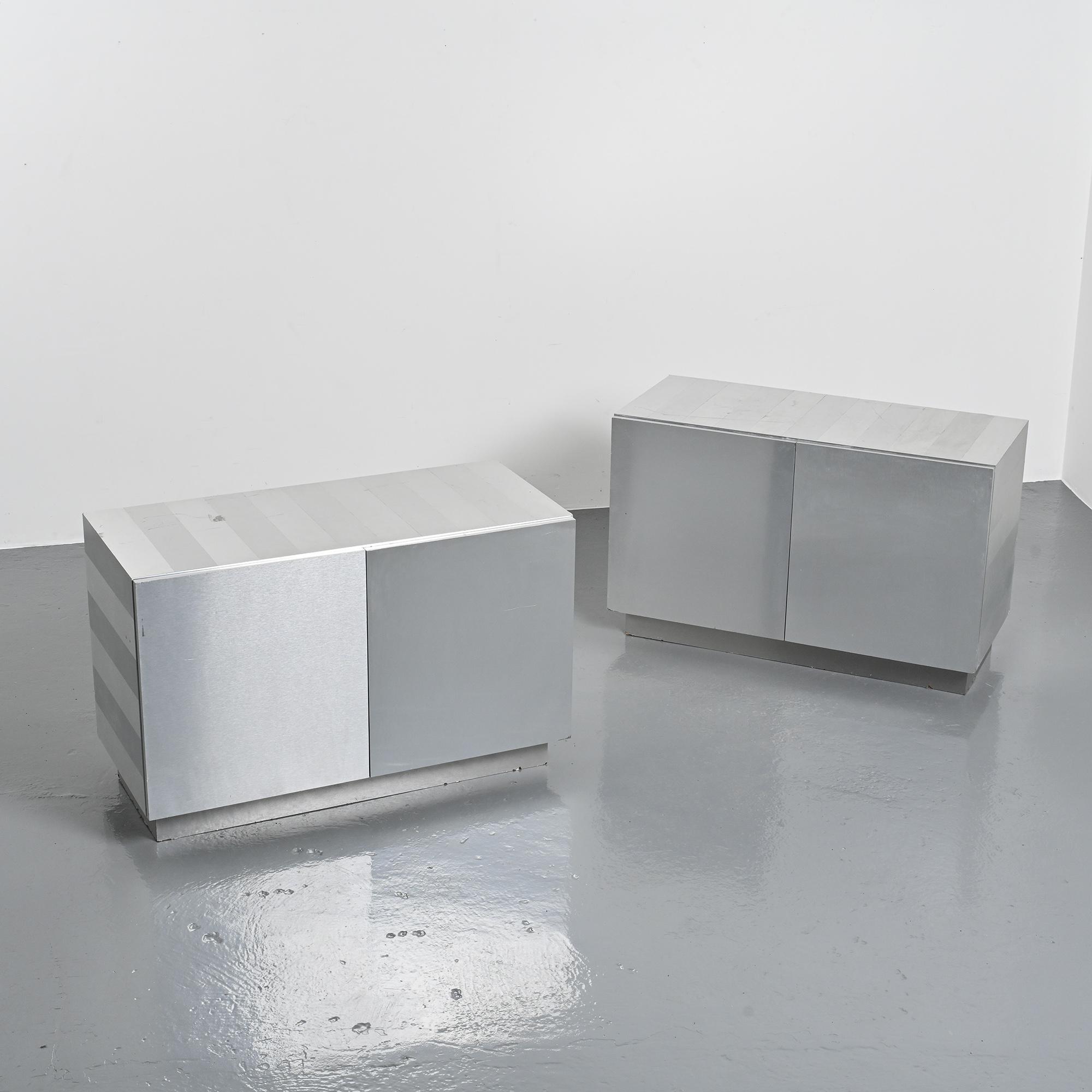 Pair of low buffets in brushed metal, French work, 1970s.