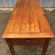 Antique farmhouse table in solid cherry wood with 3 drawers and 1 pull-out.