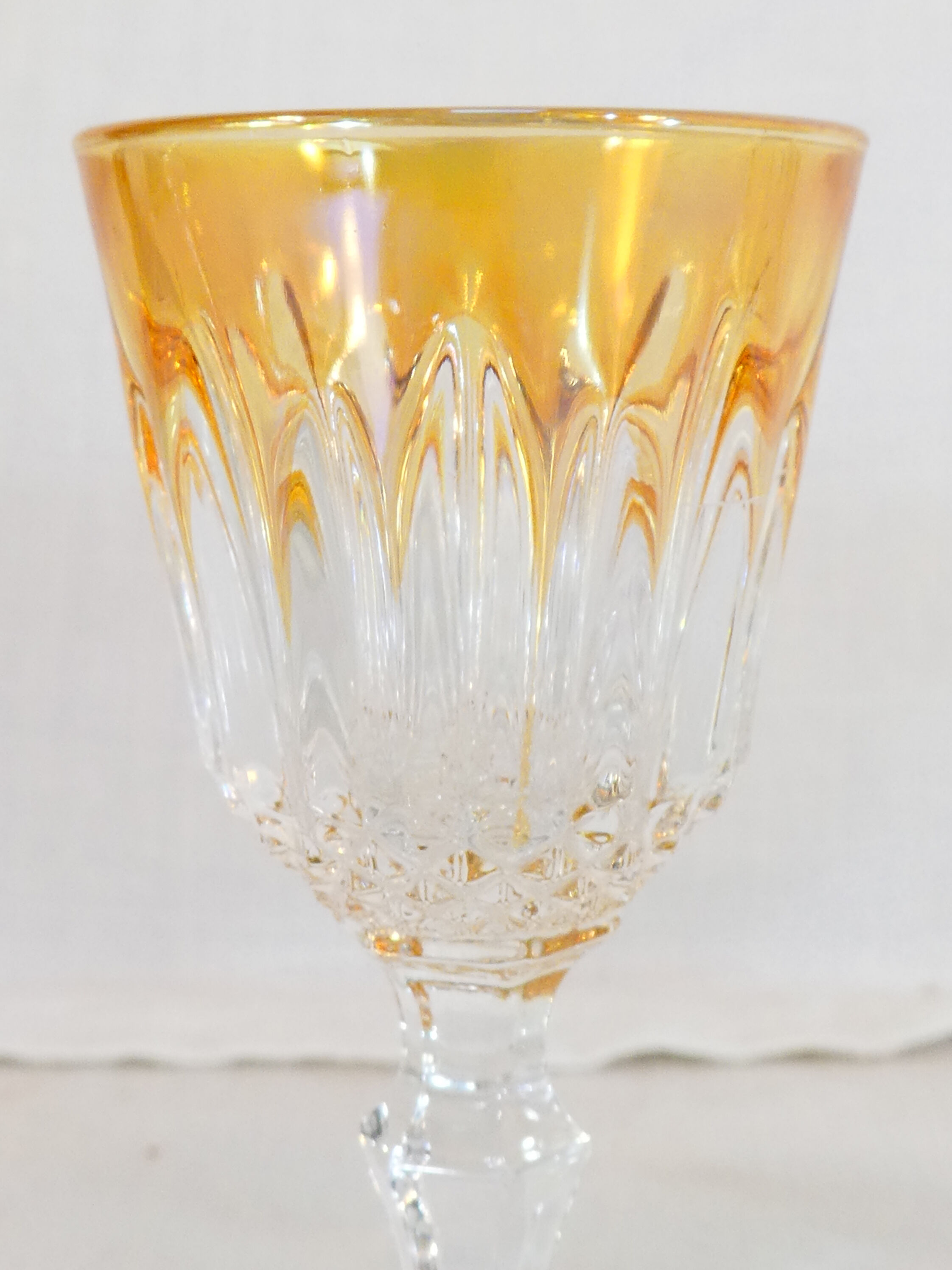 10 glasses with coloured liquor
