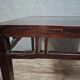 ancient Asian table, made of solid wood with a dark brown patina