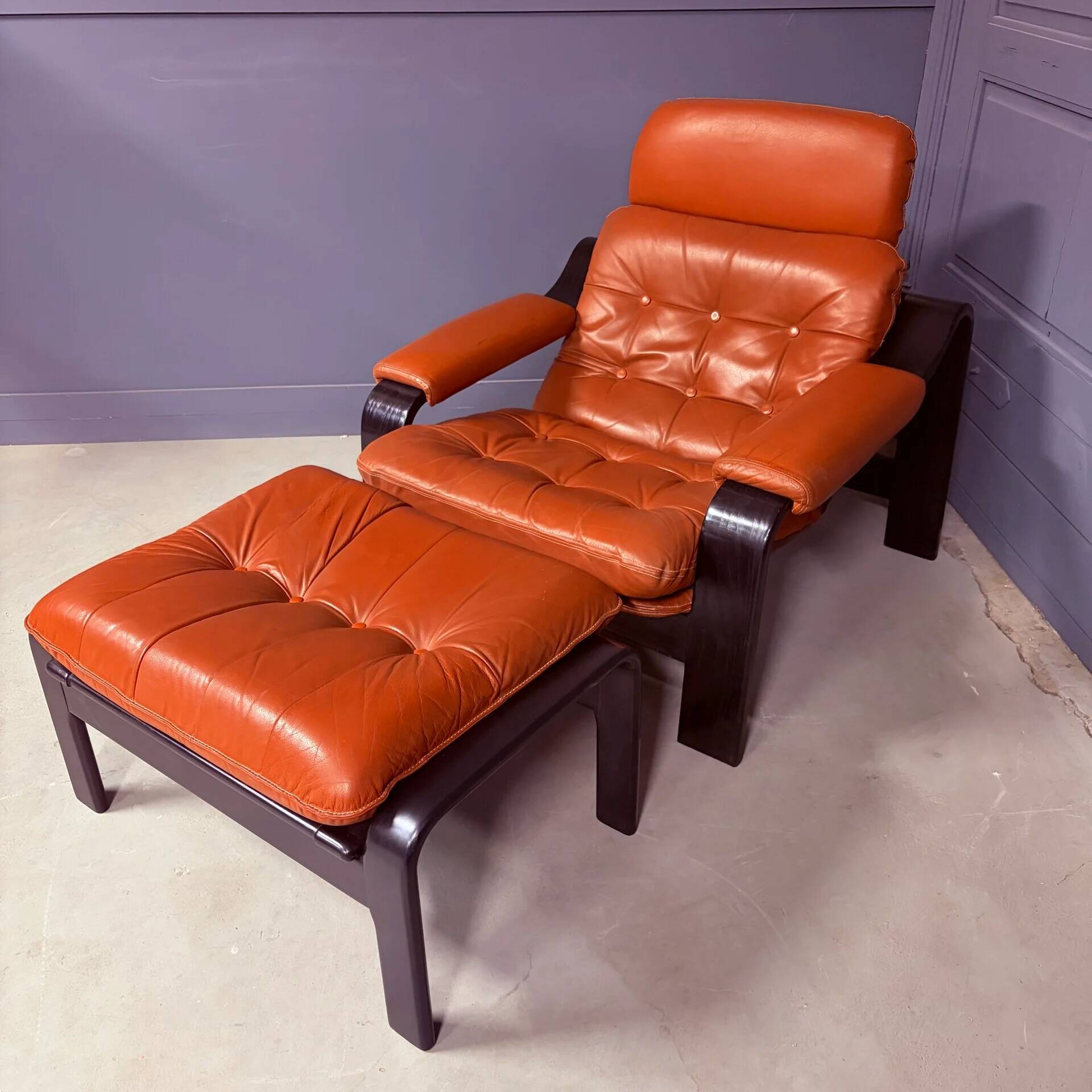 Vintage 1970s armchair with ottoman, leather and wood