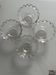 Four vintage clear glass bowls.