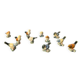 Set of 11 miniature birds in polychrome glazed ceramic.