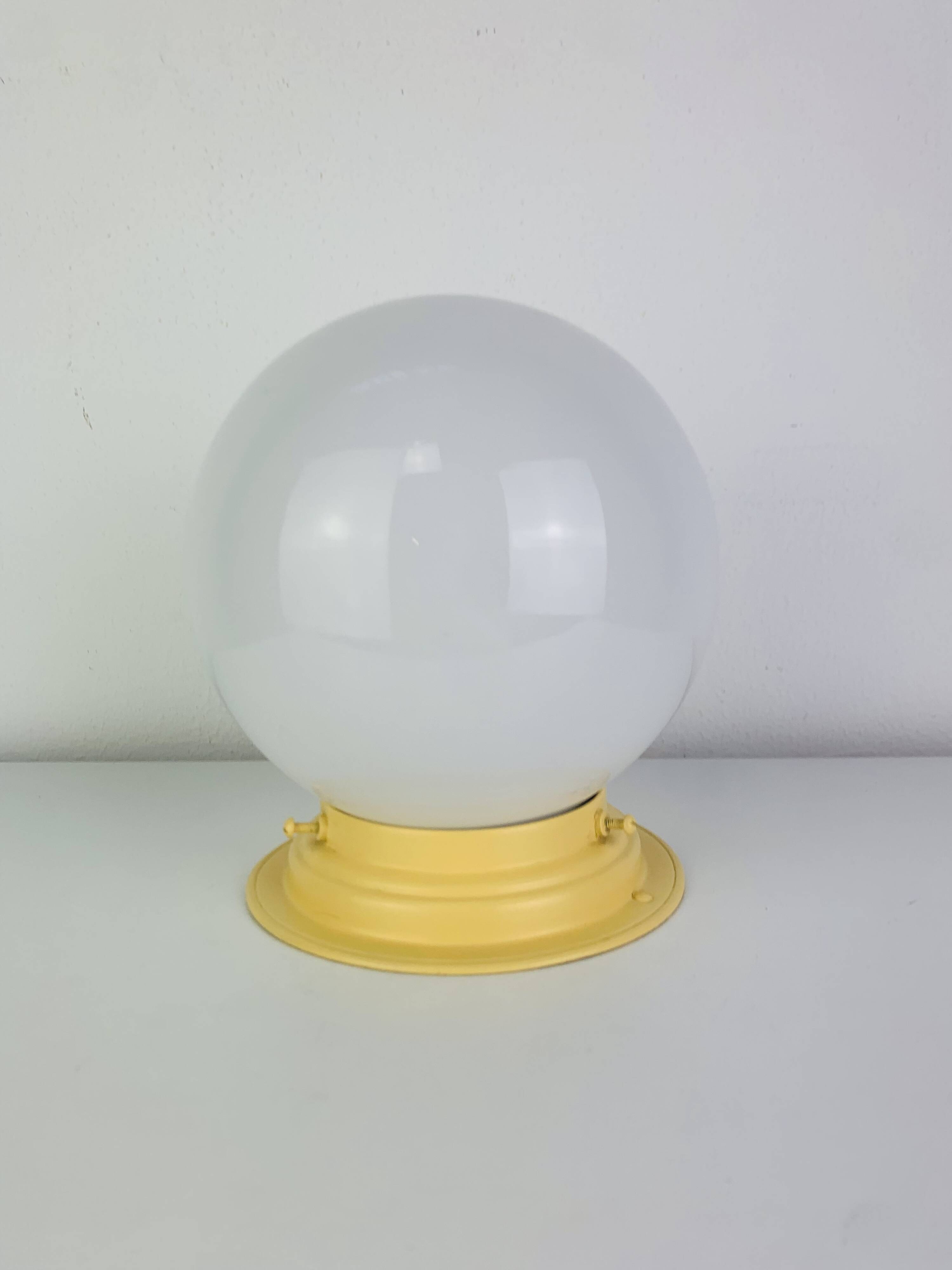 Art Deco opaline globe wall or ceiling light, yellow base