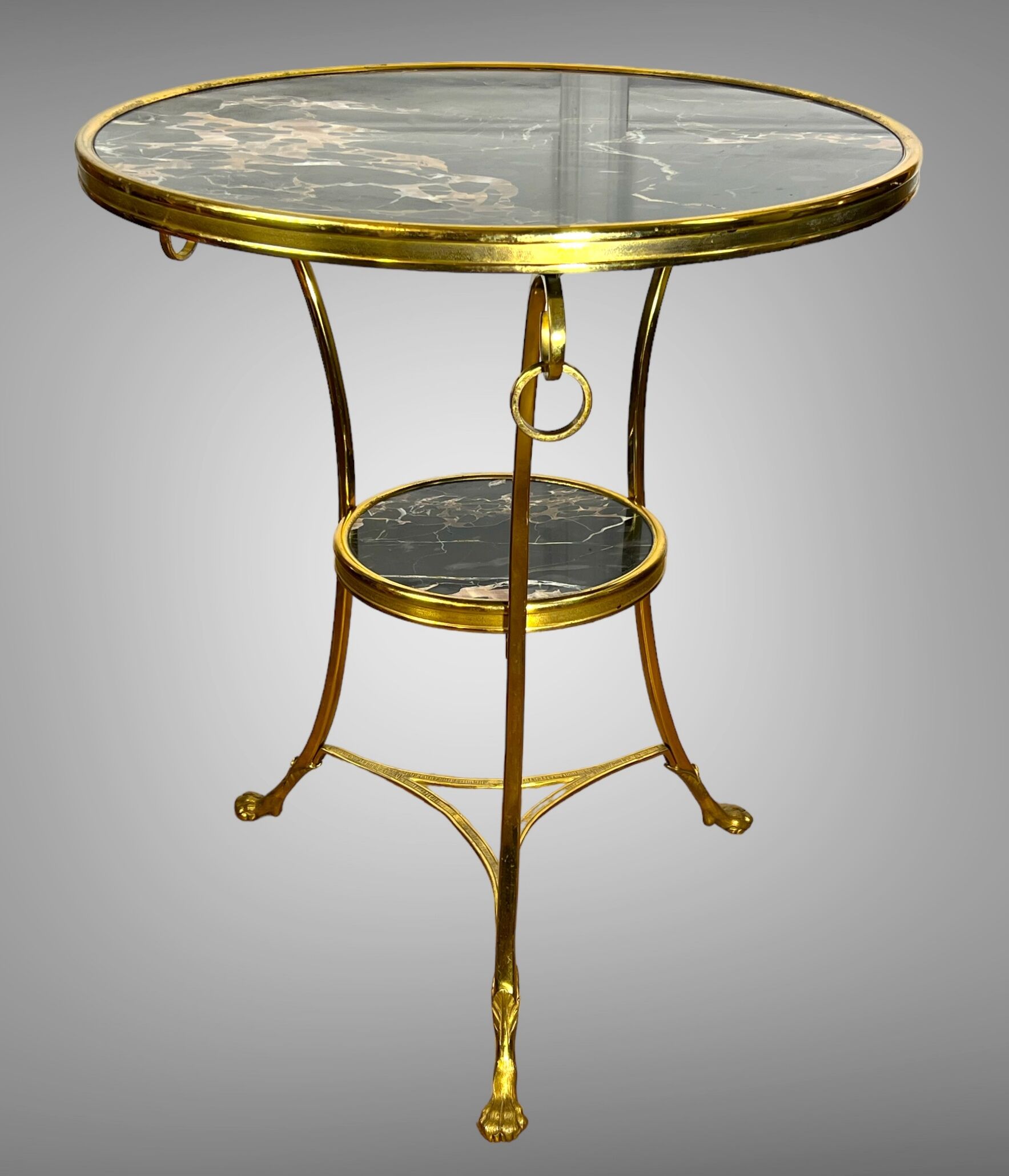 Gueridon tripod with gilded bronze frame covered with portor marble