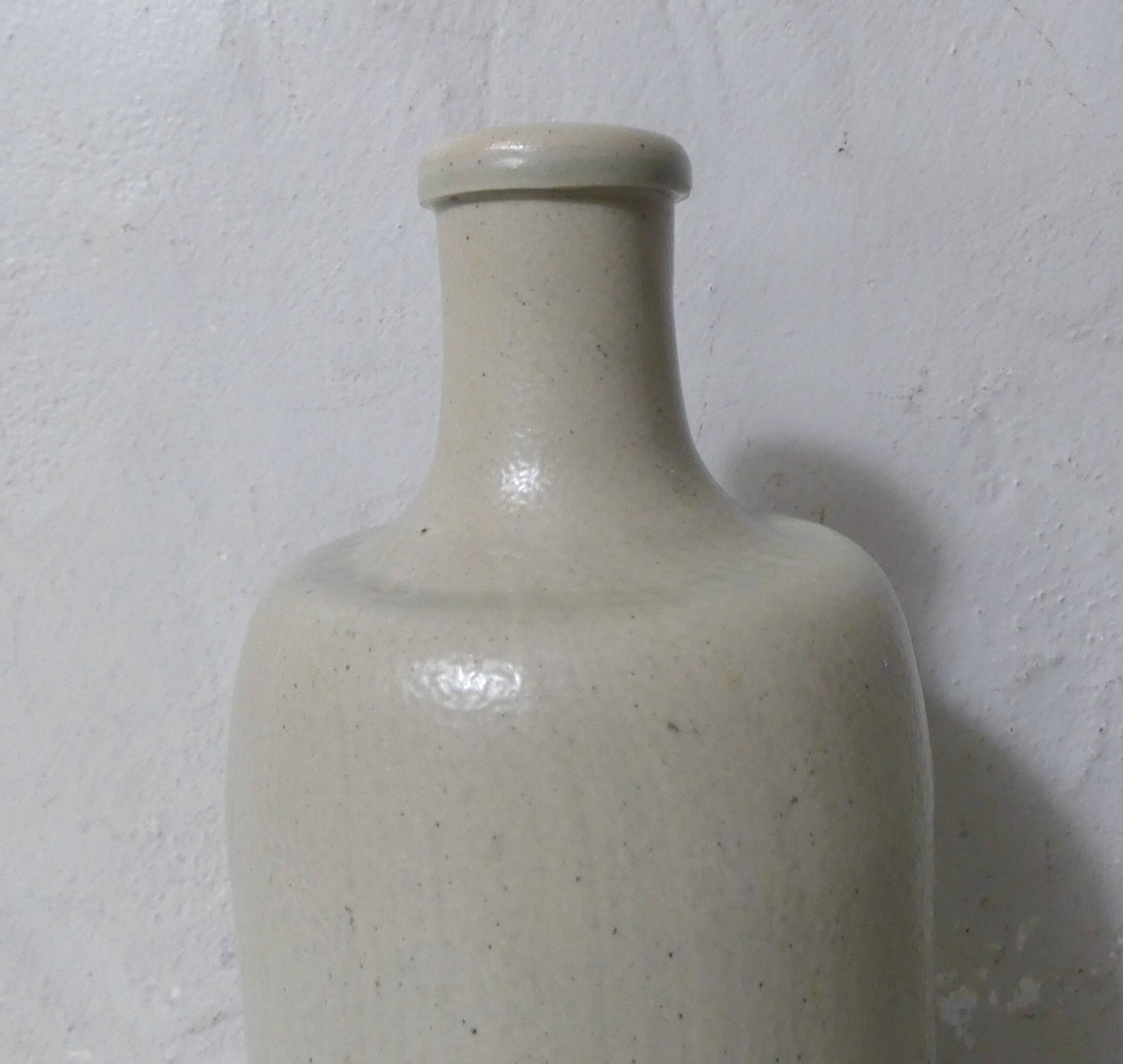 old beige stoneware bottle