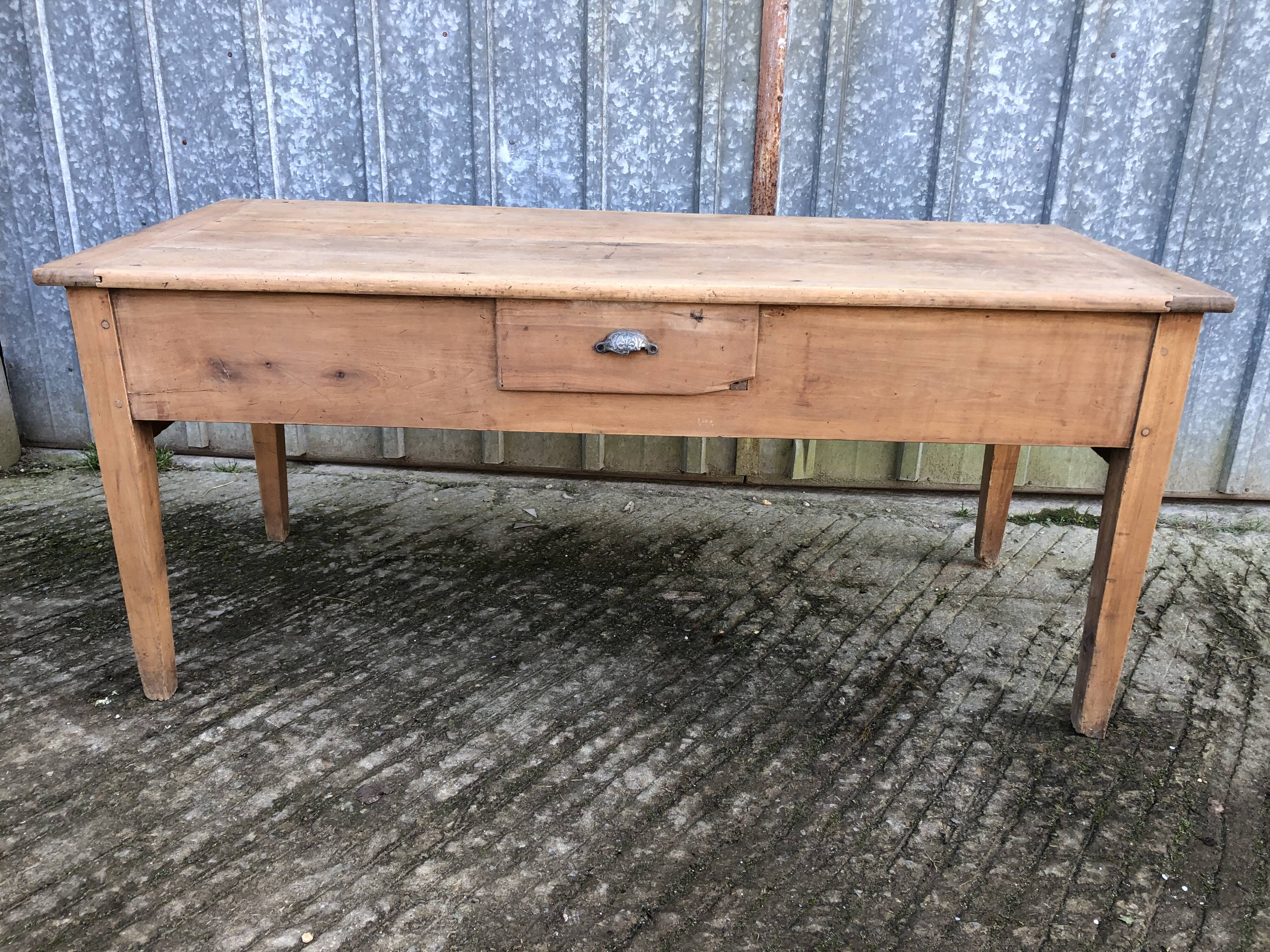 Antique solid cherry farmhouse table with 3 drawers and 1 pull out.