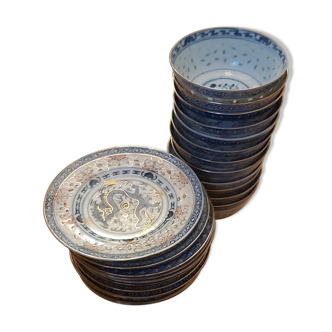 Service of 12 bowls and 12 under dishes in Chinese porcelain called rice seed of the 1960s