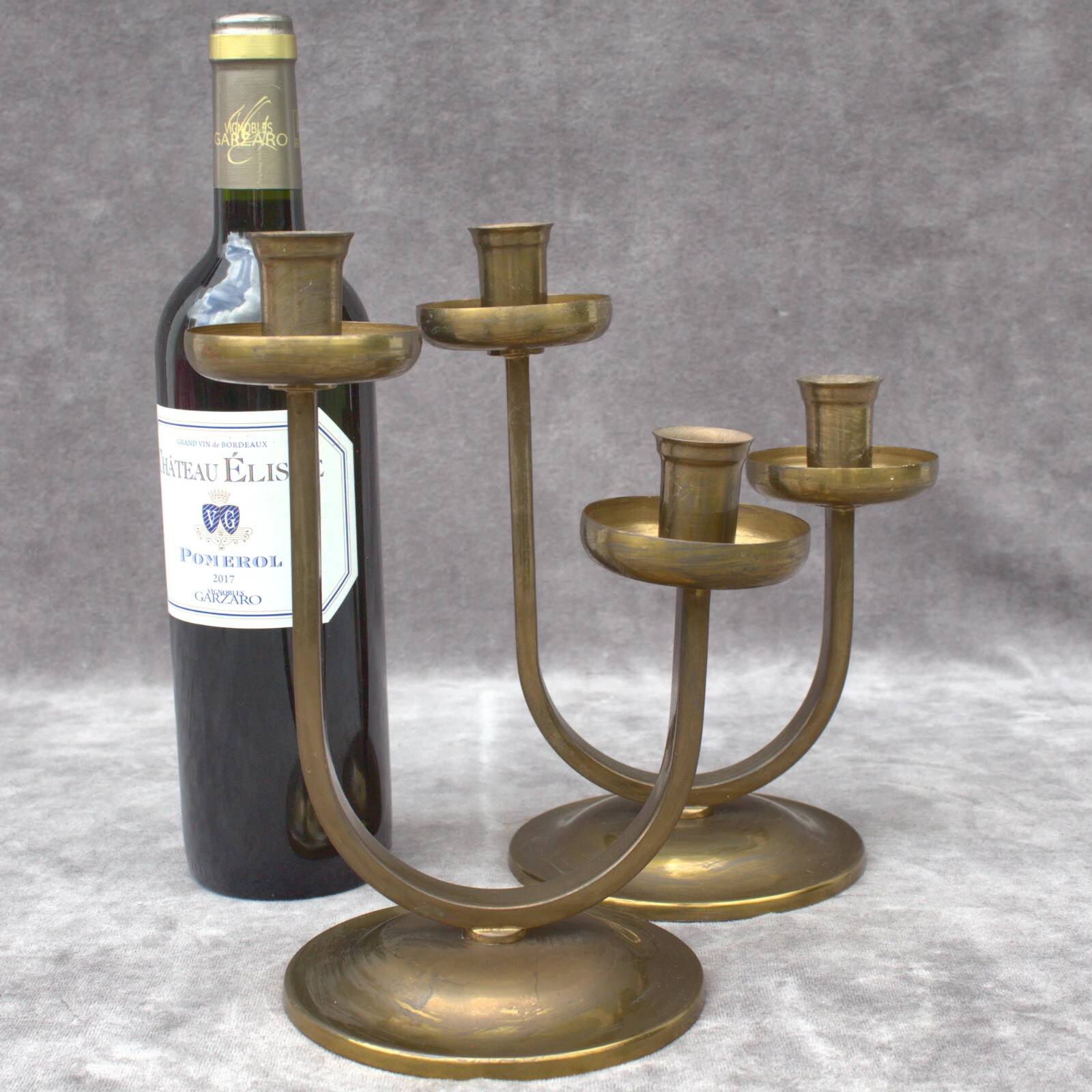 A beautiful pair of antique French Art Deco brass candlesticks