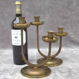A beautiful pair of antique French Art Deco brass candlesticks