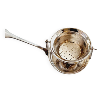 Saint Hilaire antique silver plated tilting tea strainer.