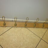 old coat rack with 5 metal hooks
