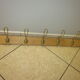 old coat rack with 5 metal hooks