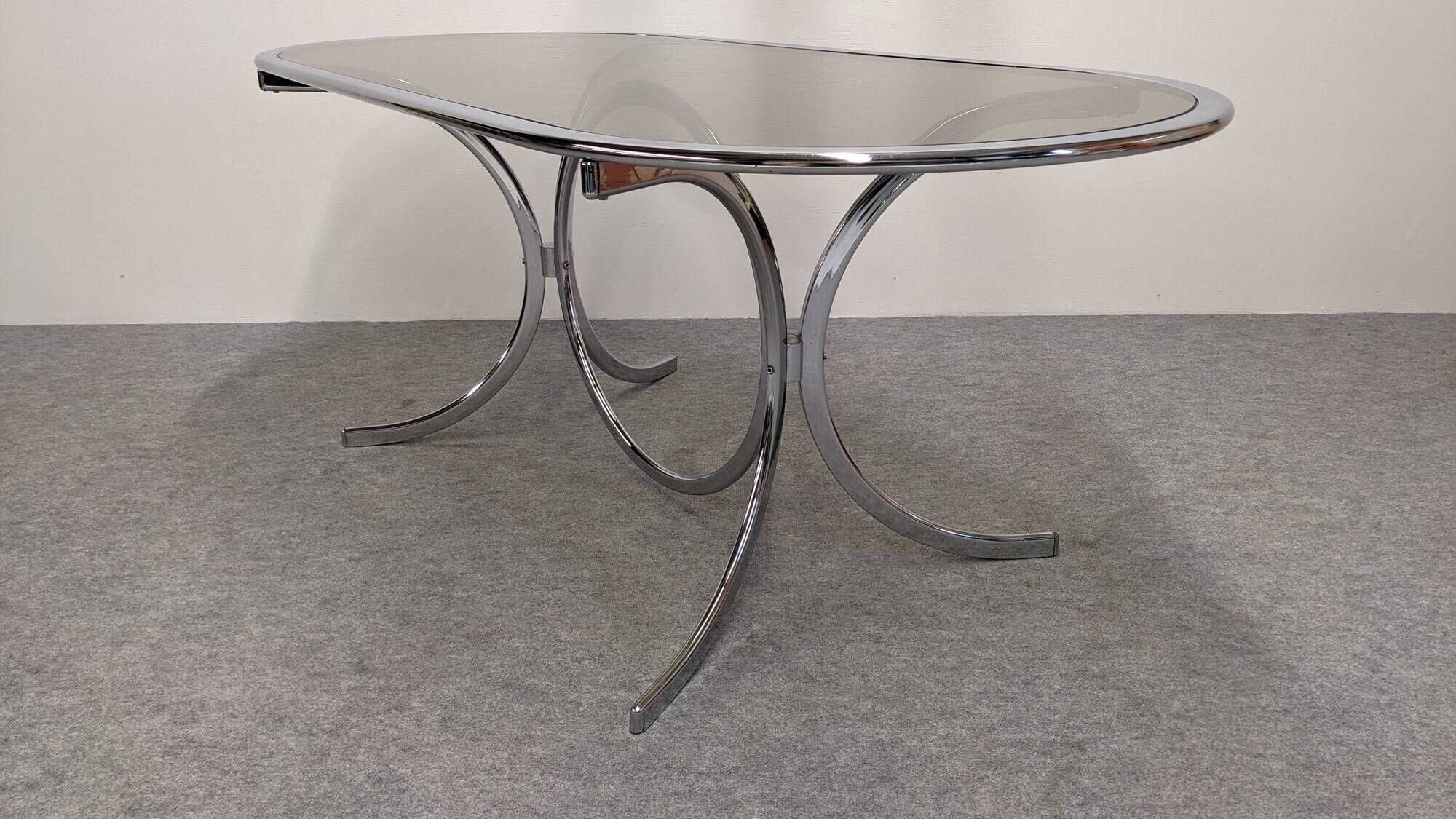 Oval dining table in chromed metal and smoked glass, Italy circa 1970