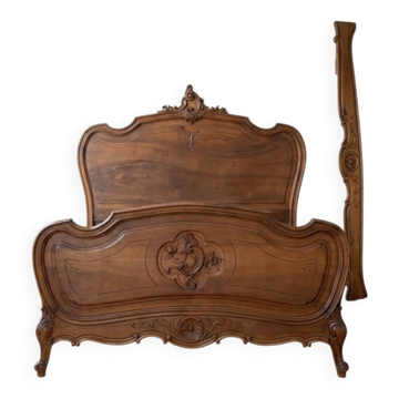 Double bed in carved wood, Louis XV style.
