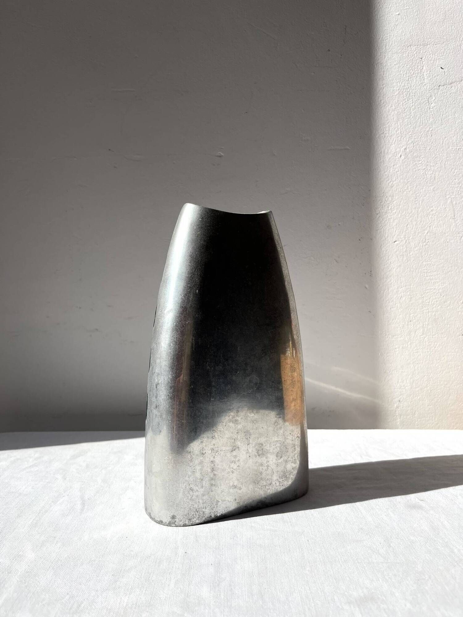 Vintage brushed aluminium vase with green stripes.