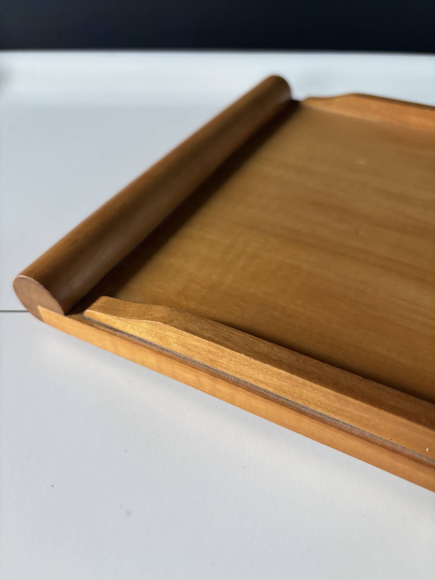 Vintage wooden plateau in Scandinavian style from the 60s — cylindrical handles.