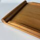 Vintage wooden plateau in Scandinavian style from the 60s — cylindrical handles.