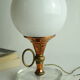 Vintage globe lamp in glass, copper, and brass.