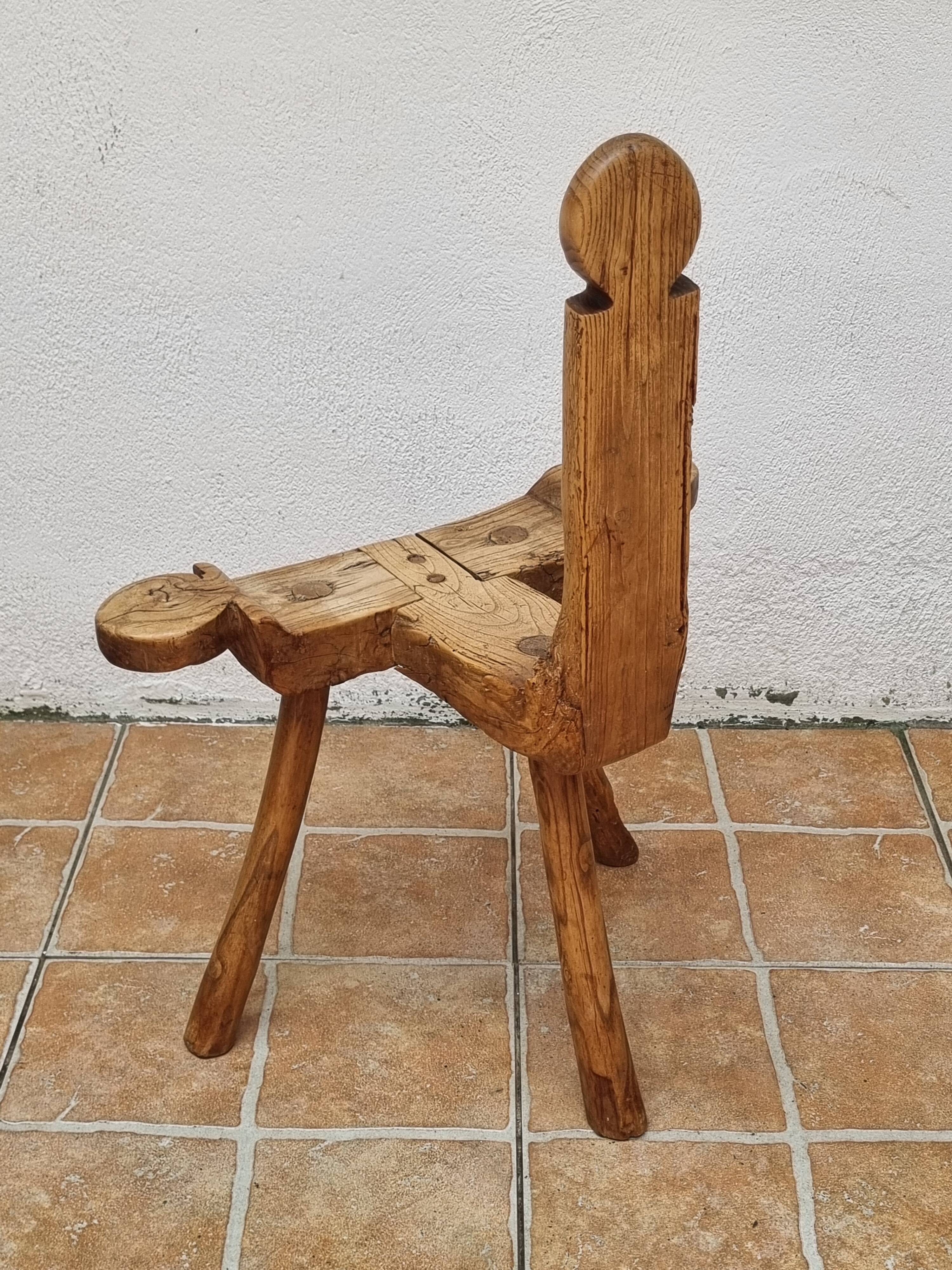Brutalist chair in solid wood, European handcrafted work from the early 20th century.