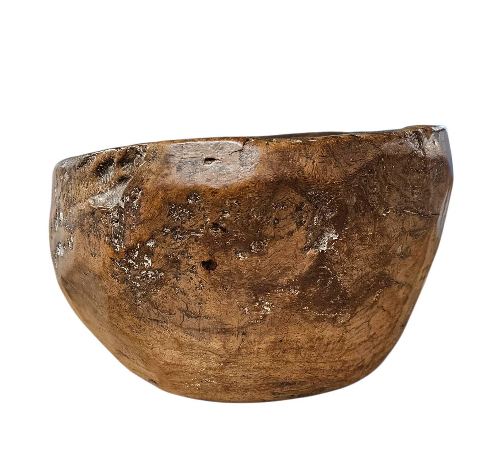 A substantial hand-hewn wooden bowl carved from a single burl section