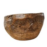 A substantial hand-hewn wooden bowl carved from a single burl section