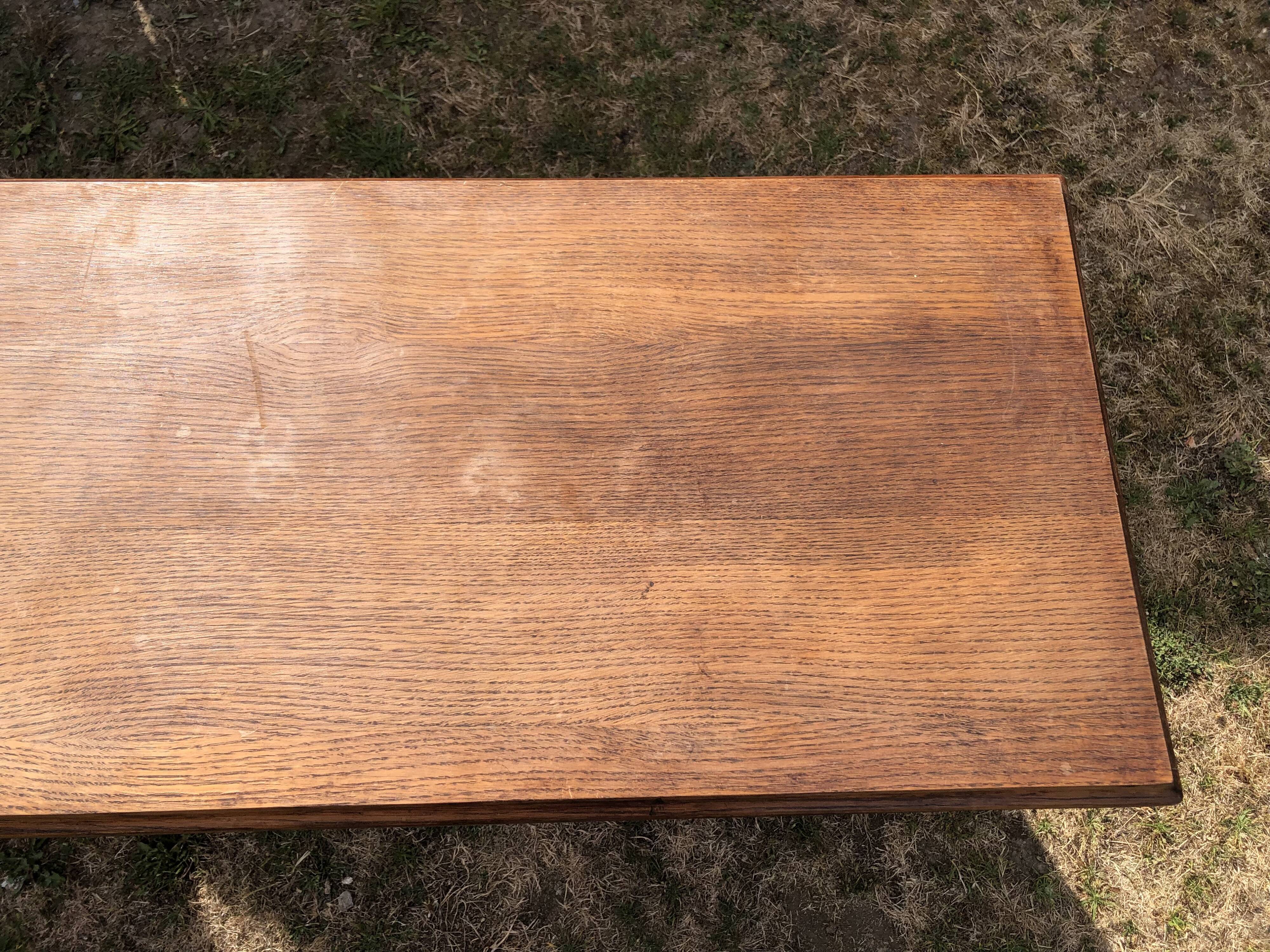 Old oak desk with curved wooden sleepers in the Art Nouveau spirit of the early 20th century.
