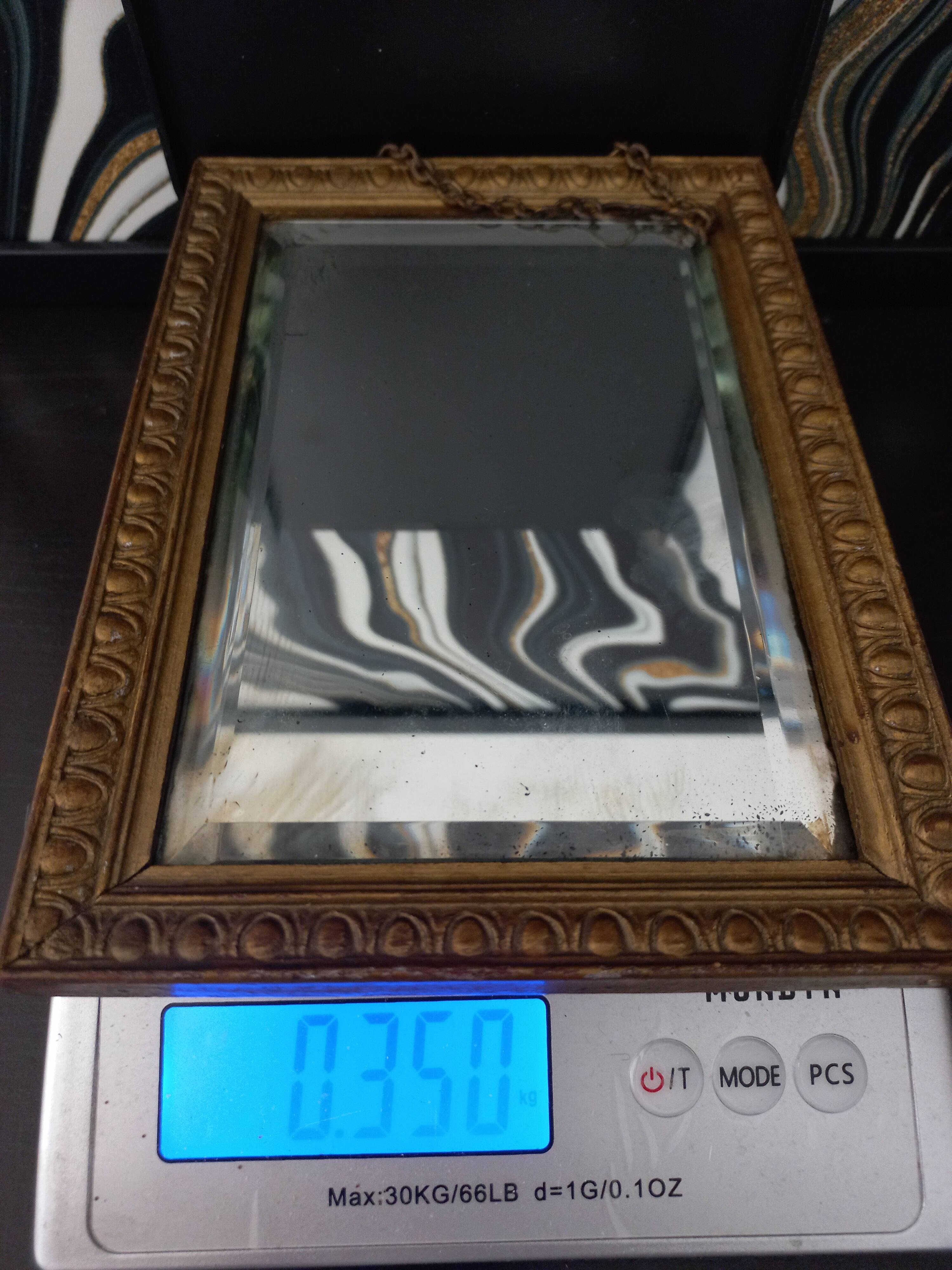 Small vintage mirror in gilded wood, bevelled glass with chain.