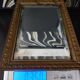 Small vintage mirror in gilded wood, bevelled glass with chain.