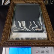 Small vintage mirror in gilded wood, bevelled glass with chain.